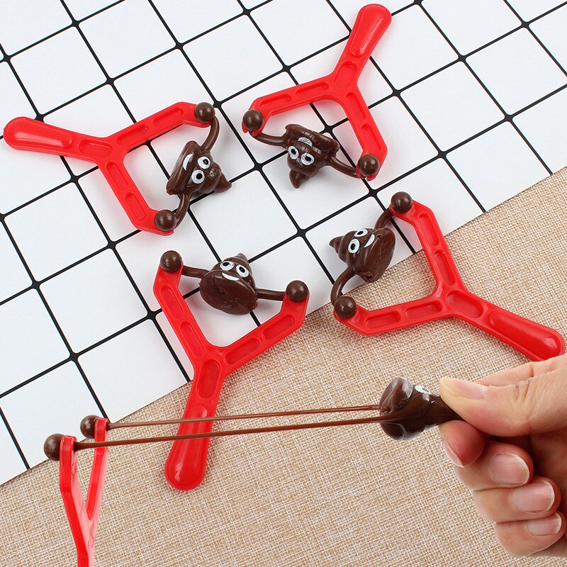 SlingyShots™ - Smiley Pupse Schleuder Spielzeug